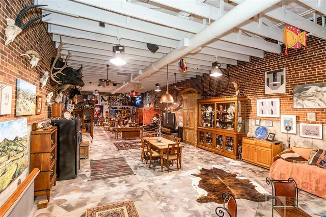 a building outdoor space with patio furniture and potted plants