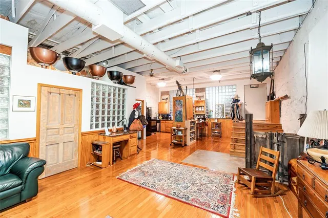 a large kitchen with lots of counter top space and stainless steel appliances