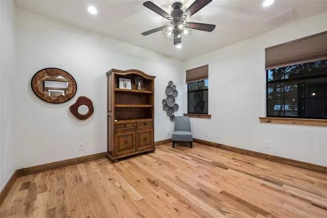 a living room with furniture potted plant and a fireplace