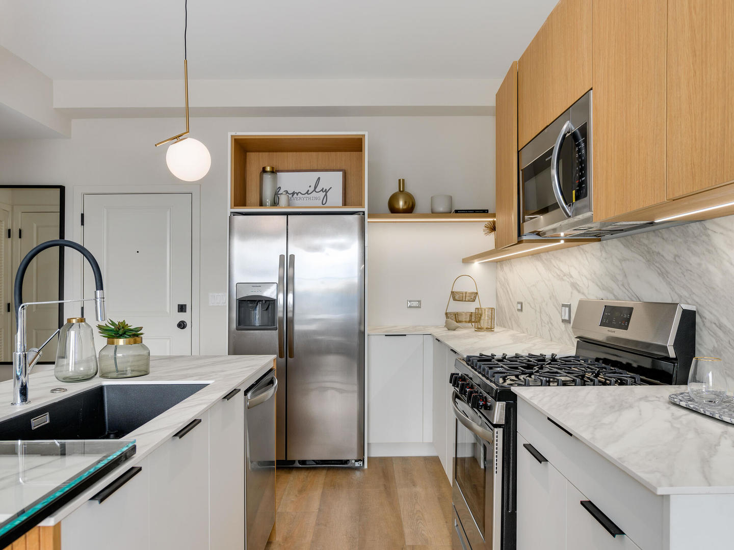 2811 Thatcher Avenue, Unit 301 River Grove, IL 60171 - Photo 6 of 39 a kitchen with granite countertop stainless steel appliances and wooden floor