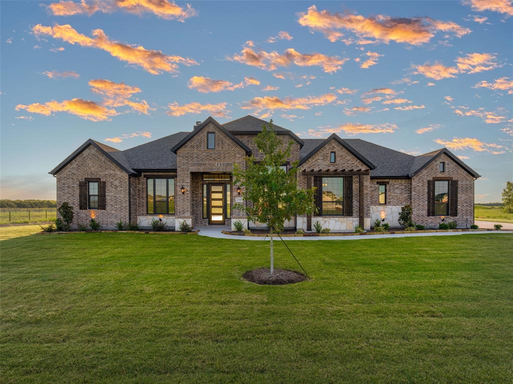 2108 Charters Circle Nevada, TX 75173 - Photo 1 of 37 View of front of house featuring brick siding, a yard, and roof with shingles