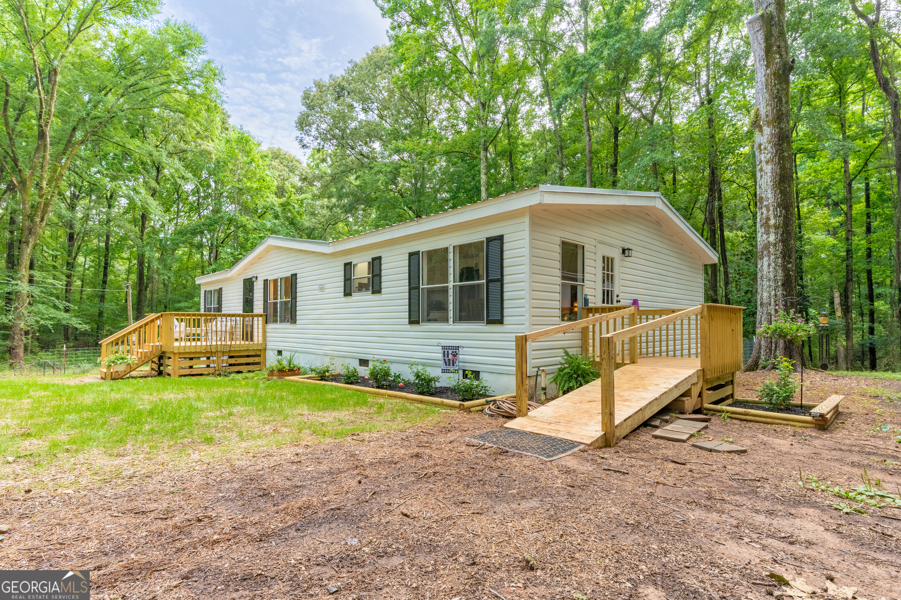 452 Aikenton Road Monticello, GA 31064 - Photo 3 of 47 a view of a house with a yard