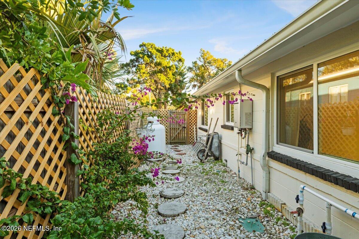 149 Menendez Road St. Augustine, FL 32080 - Photo 42 of 55 Garden Walkway and Side Yard