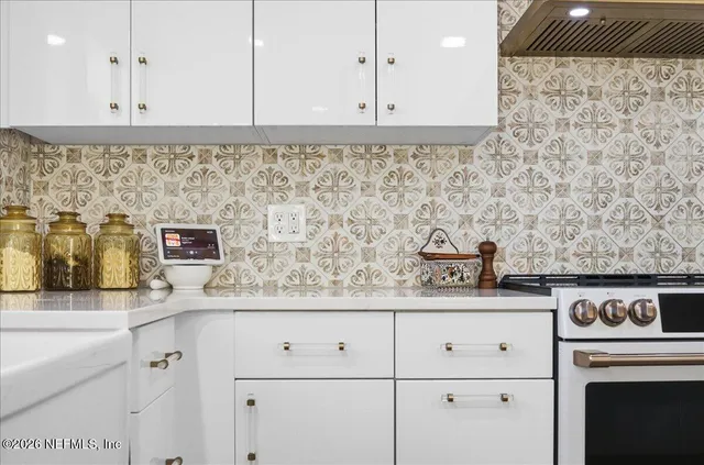 a kitchen with a stove and cabinets