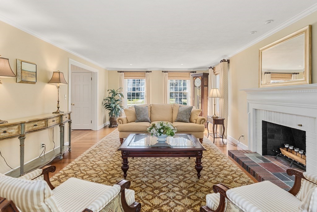 7 Nantucket Road Wellesley, MA 02481 - Photo 15 of 37 a living room with furniture a fireplace and a table