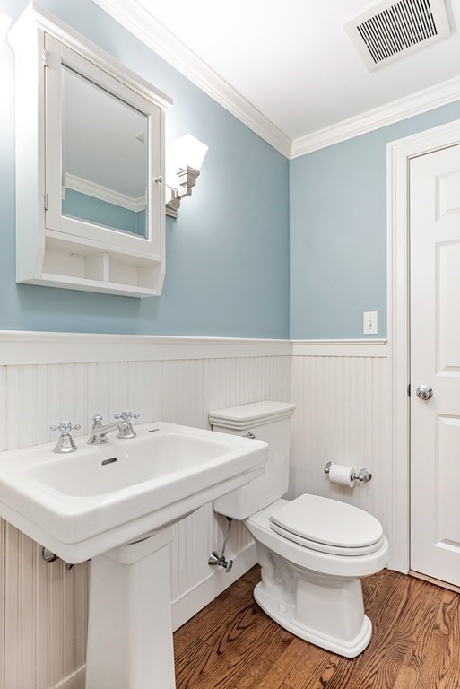 7 Nantucket Road Wellesley, MA 02481 - Photo 17 of 37 a bathroom with a sink a mirror and a toilet