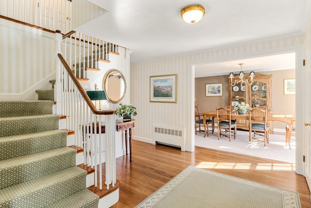 7 Nantucket Road Wellesley, MA 02481 - Photo 20 of 37 a view of staircase with furniture and a chandelier
