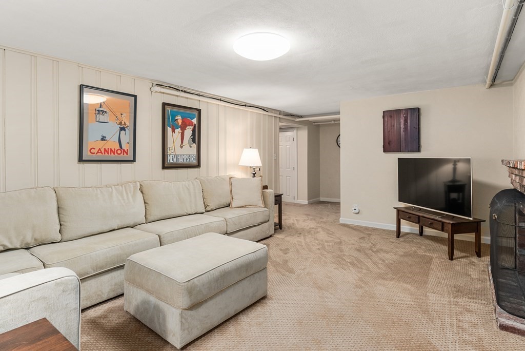 7 Nantucket Road Wellesley, MA 02481 - Photo 30 of 37 a living room with furniture and a flat screen tv