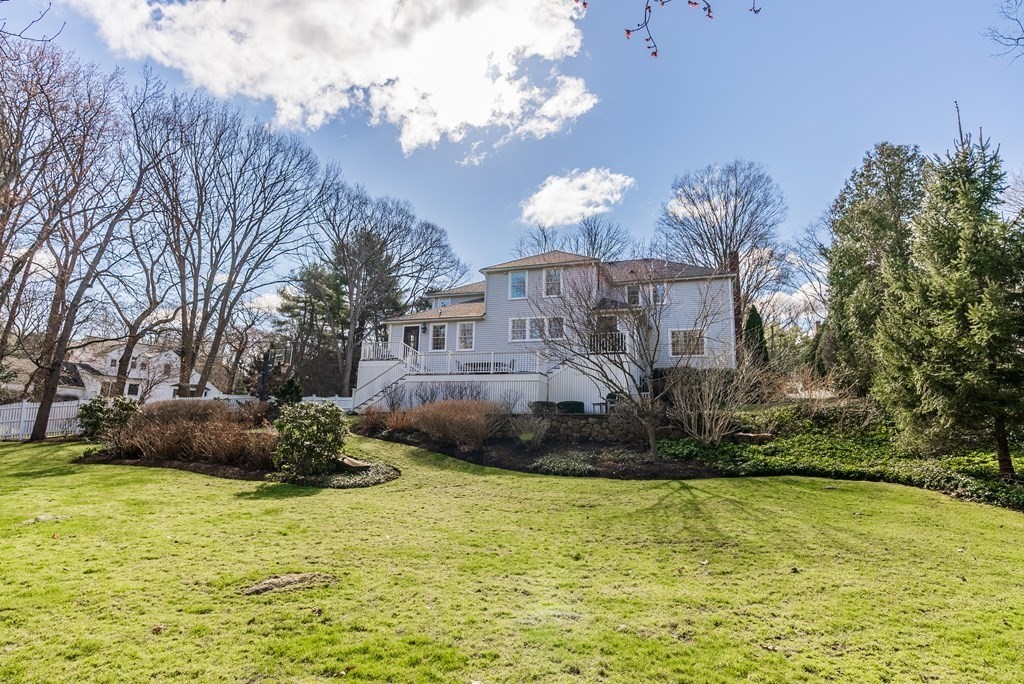 7 Nantucket Road Wellesley, MA 02481 - Photo 34 of 37 a front view of a house with a yard and fountain