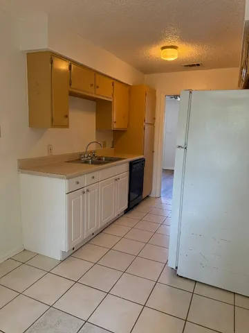 a kitchen with stainless steel appliances granite countertop a sink and cabinets