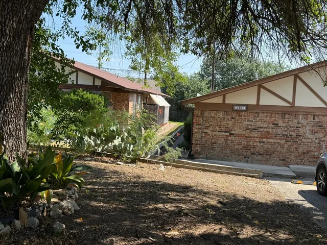 a view of a house with a small yard