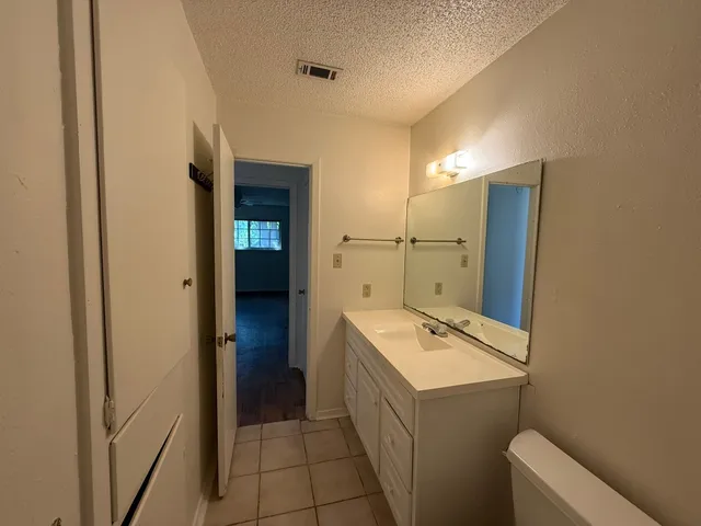 a bathroom with a sink and mirror