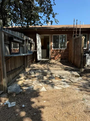 a backyard of a house with seating space