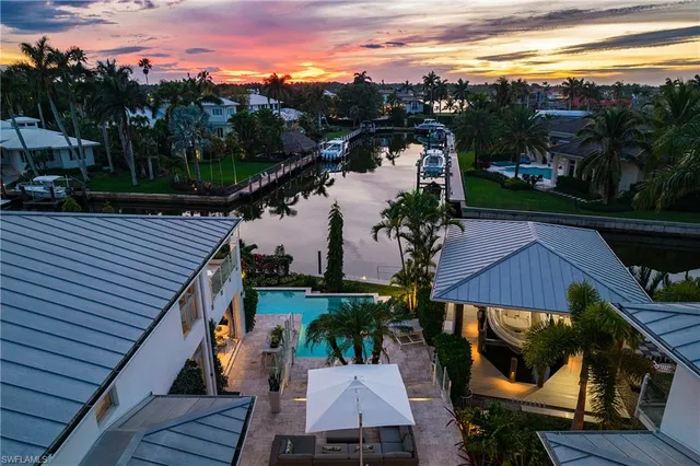 a view of a balcony with two chairs and a table