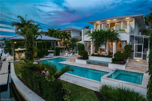 a view of house with outdoor space and swimming pool