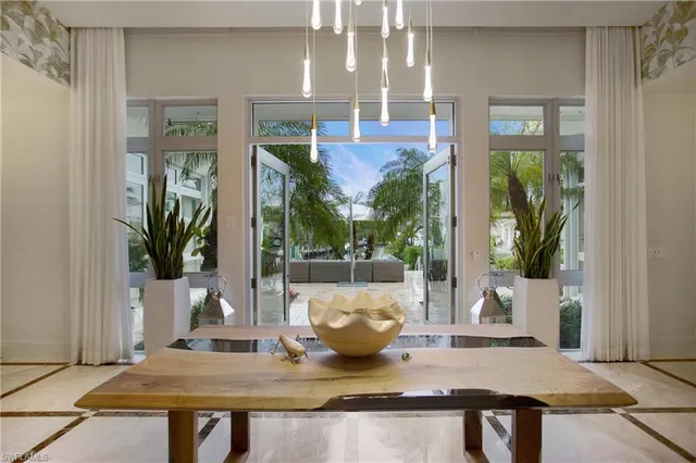 a view of kitchen with sink and refrigerator