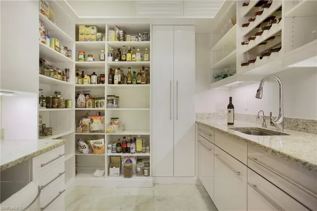 a view of a kitchen with fridge and rack