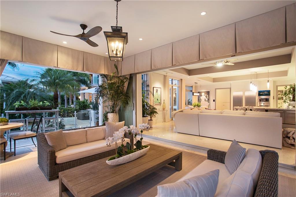 2290 Tarpon Road Naples, FL 34102 - Photo 31 of 50 a living room with furniture and a chandelier