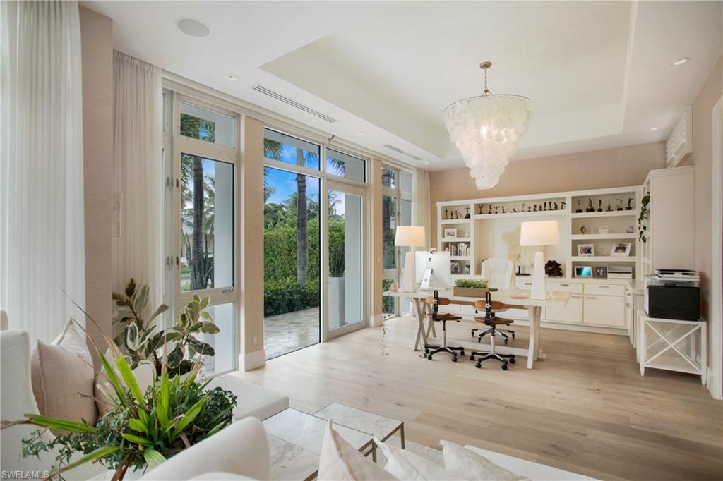 2290 Tarpon Road Naples, FL 34102 - Photo 35 of 50 a living room with furniture and a large window