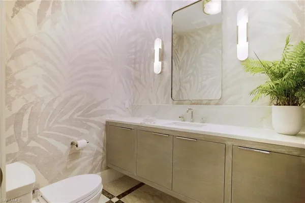 a bathroom with a sink and a toilet