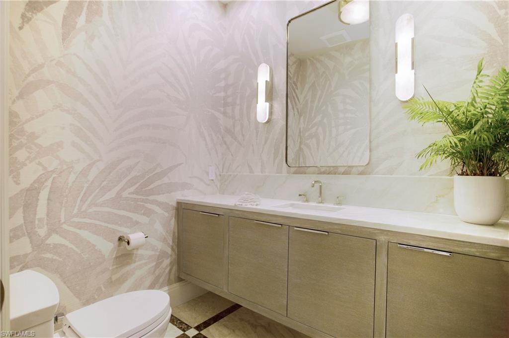 2290 Tarpon Road Naples, FL 34102 - Photo 38 of 50 a bathroom with a sink and a toilet