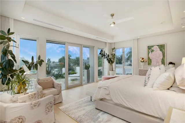 a bedroom with a large bed and a couch