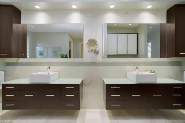 a living room with furniture a window and potted plant