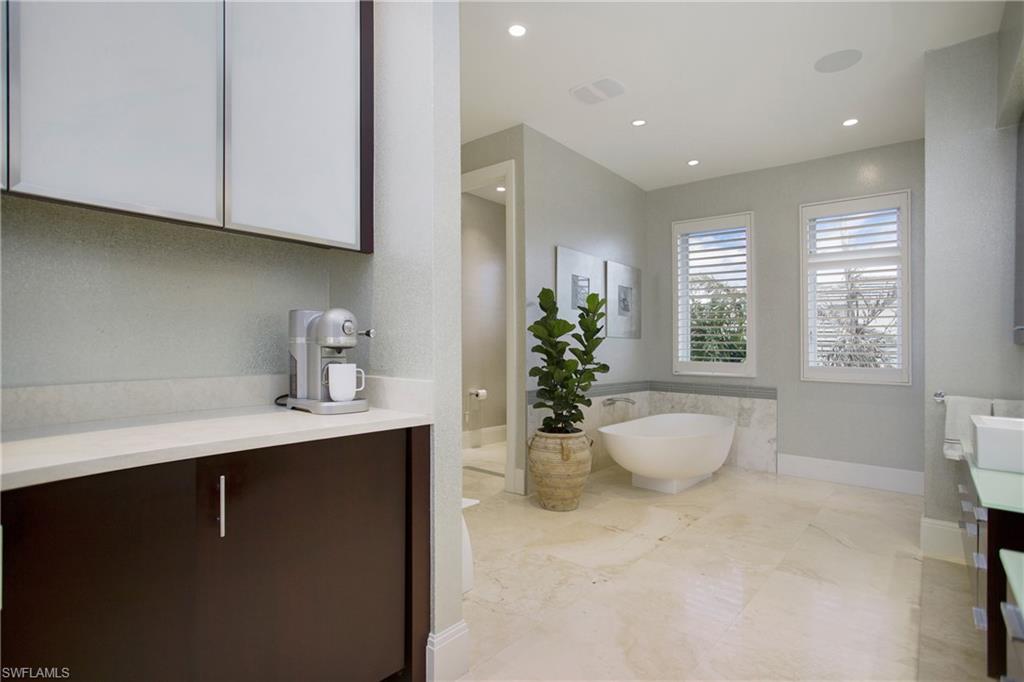2290 Tarpon Road Naples, FL 34102 - Photo 43 of 50 a living room with furniture a window and potted plant