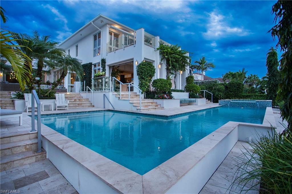 2290 Tarpon Road Naples, FL 34102 - Photo 6 of 50 a view of a house with pool porch and sitting area