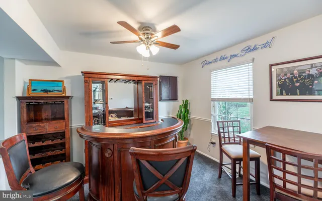a view of a livingroom with furniture and a flat screen tv