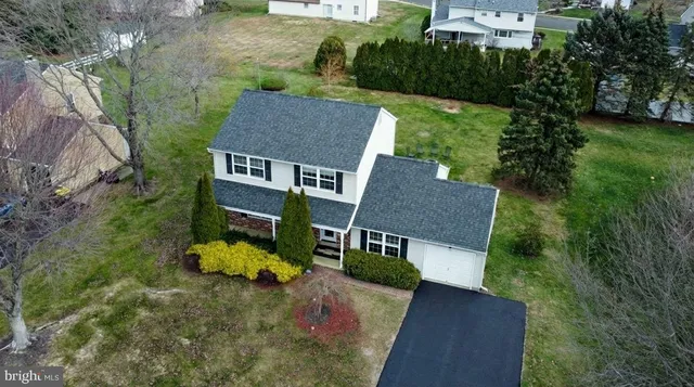 an aerial view of a house with a garden