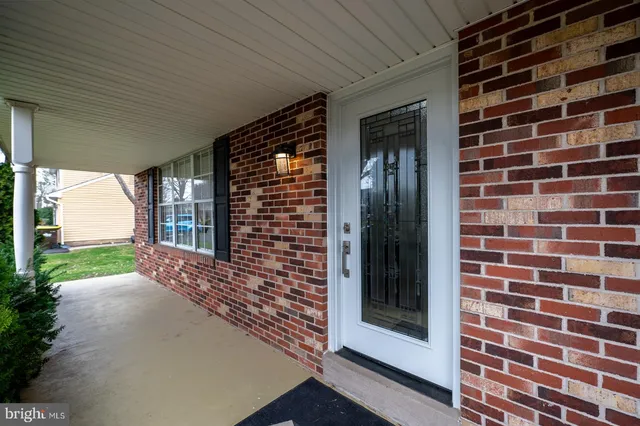 a view of a brick house with a large window