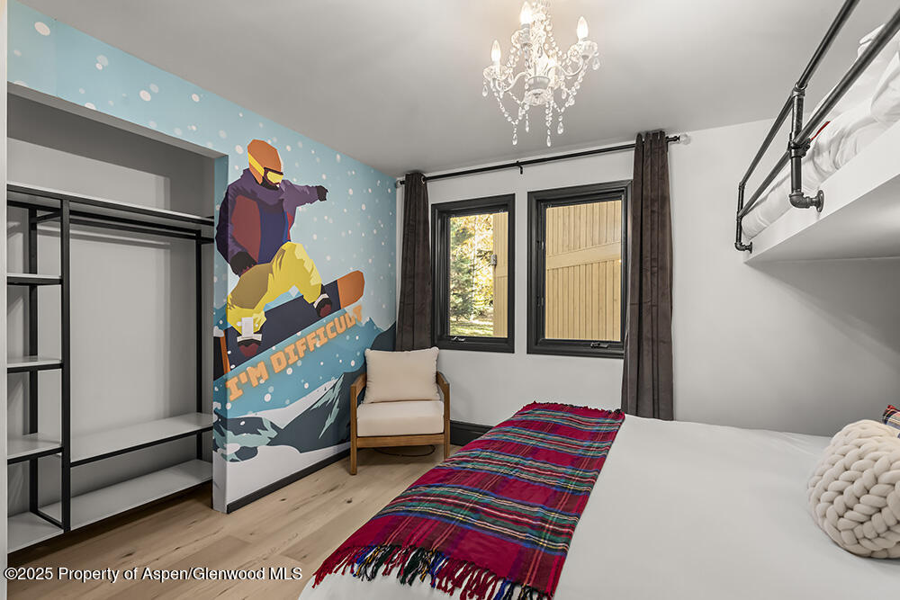 35 Upper Woodbridge Road, Unit 2A Snowmass Village, CO 81615 - Photo 16 of 29 a bedroom with a bed and window