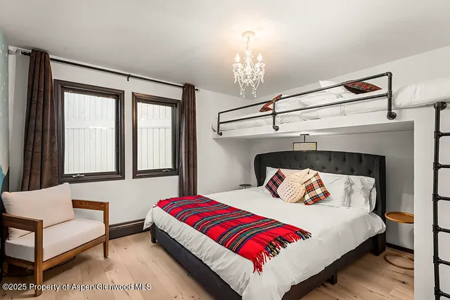 a bathroom with a sink mirror and vanity