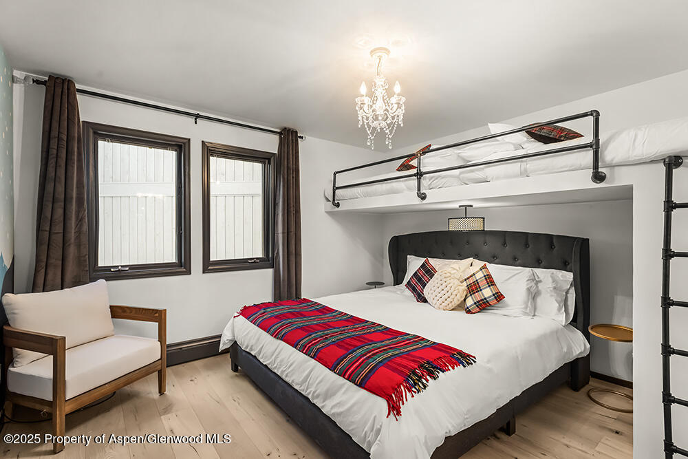 35 Upper Woodbridge Road, Unit 2A Snowmass Village, CO 81615 - Photo 17 of 29 a bedroom with a bed and window