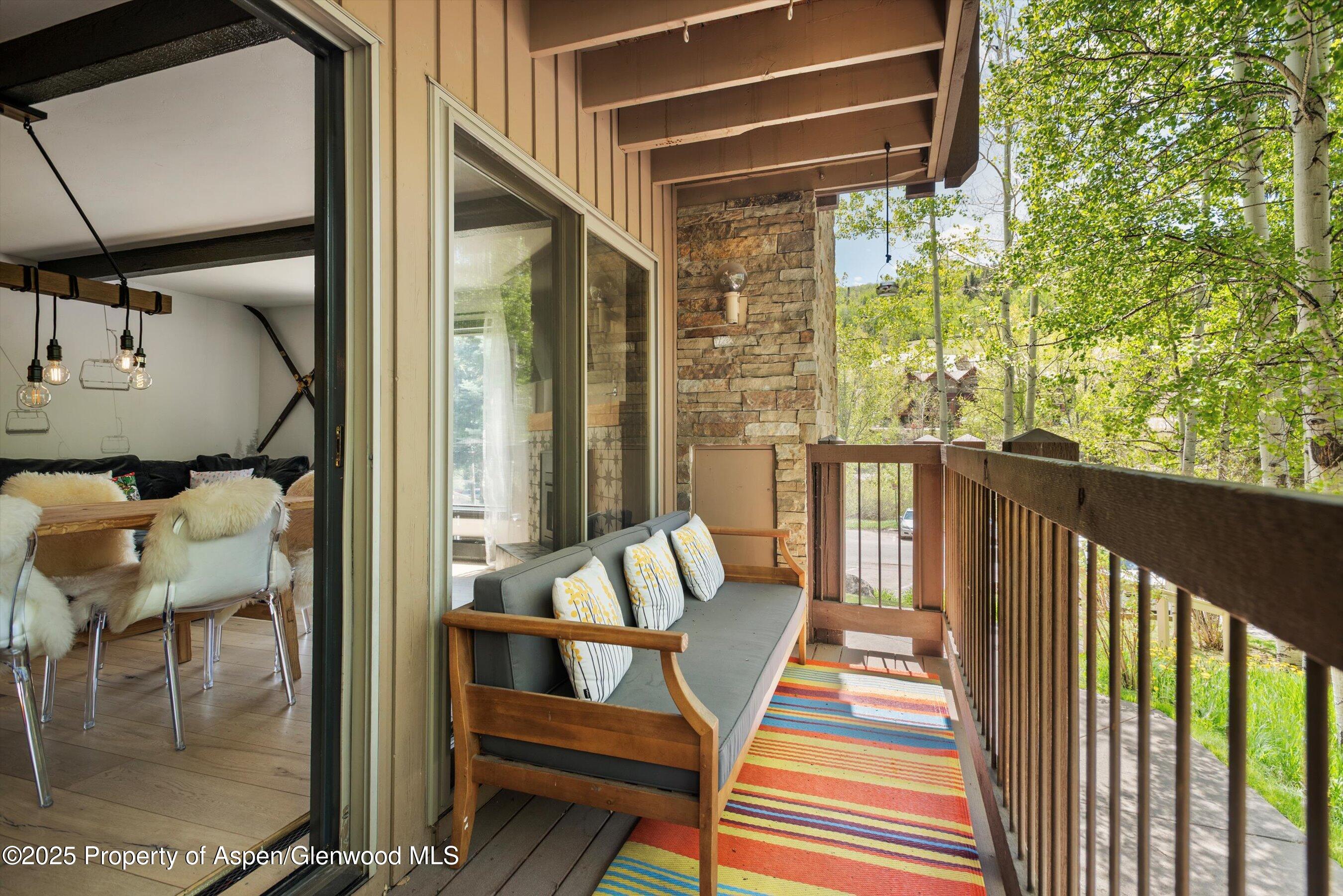 35 Upper Woodbridge Road, Unit 2A Snowmass Village, CO 81615 - Photo 22 of 29 a balcony view with a large window