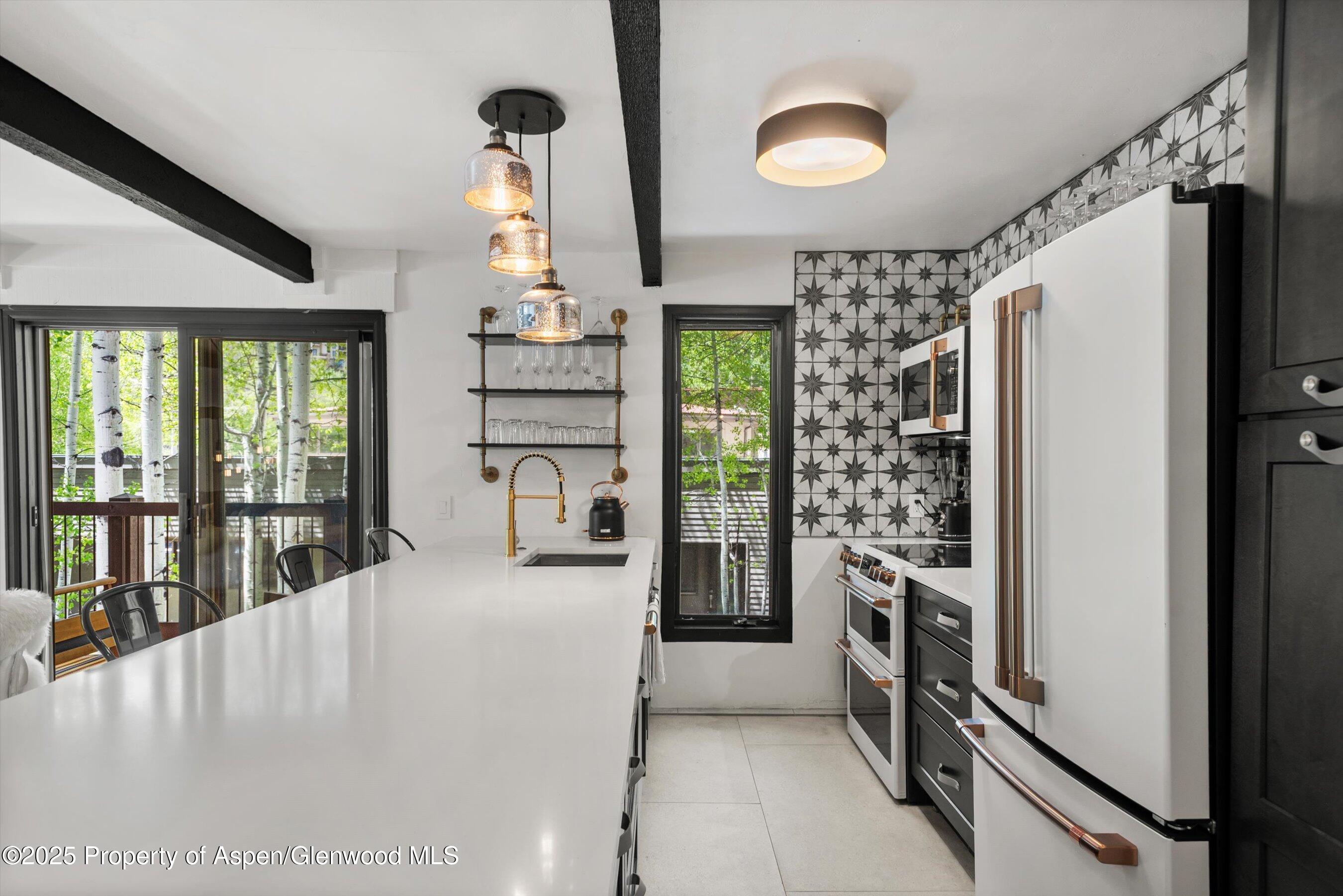 35 Upper Woodbridge Road, Unit 2A Snowmass Village, CO 81615 - Photo 5 of 29 a view of kitchen with furniture and windows