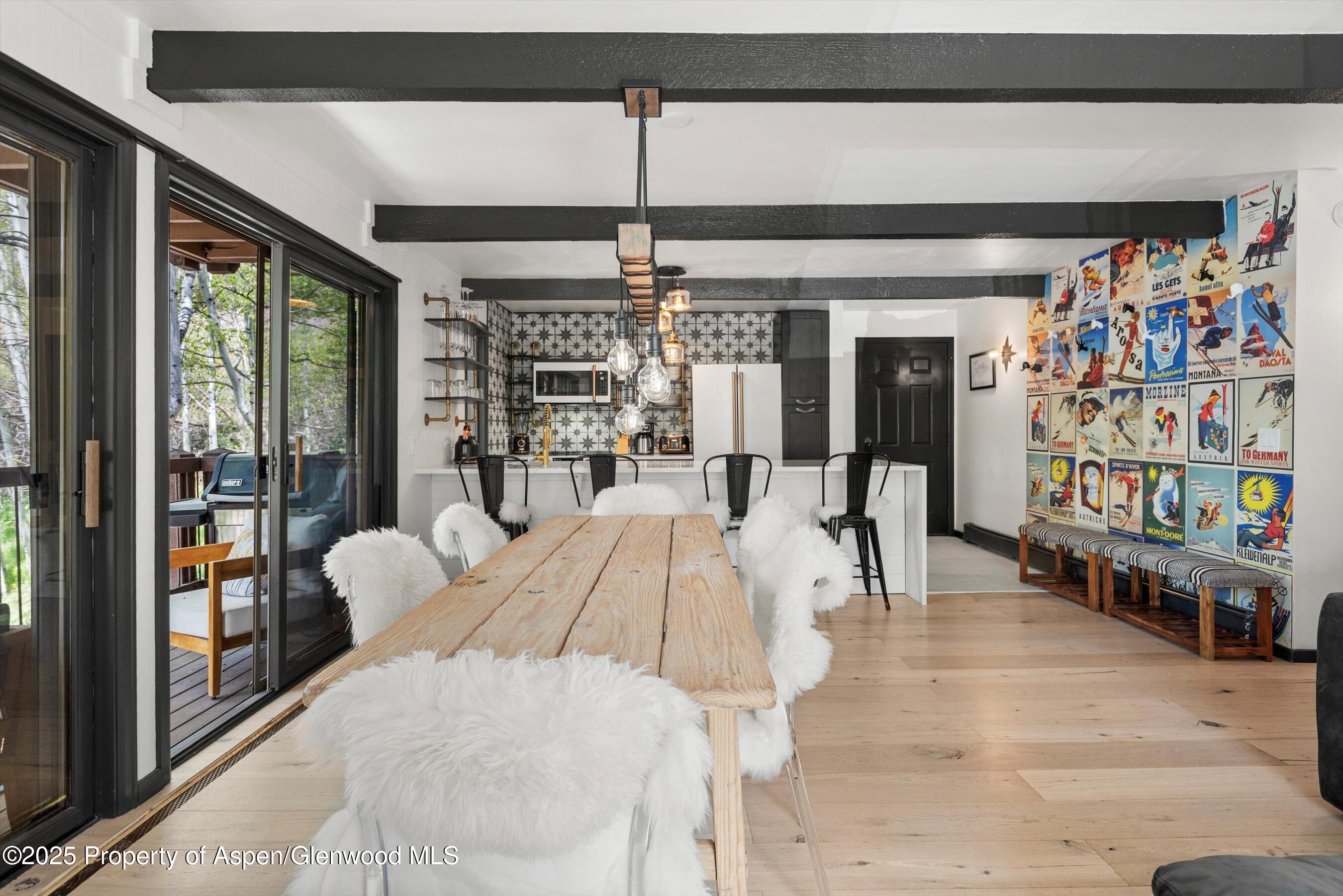 35 Upper Woodbridge Road, Unit 2A Snowmass Village, CO 81615 - Photo 9 of 29 a living room with furniture and a chandelier