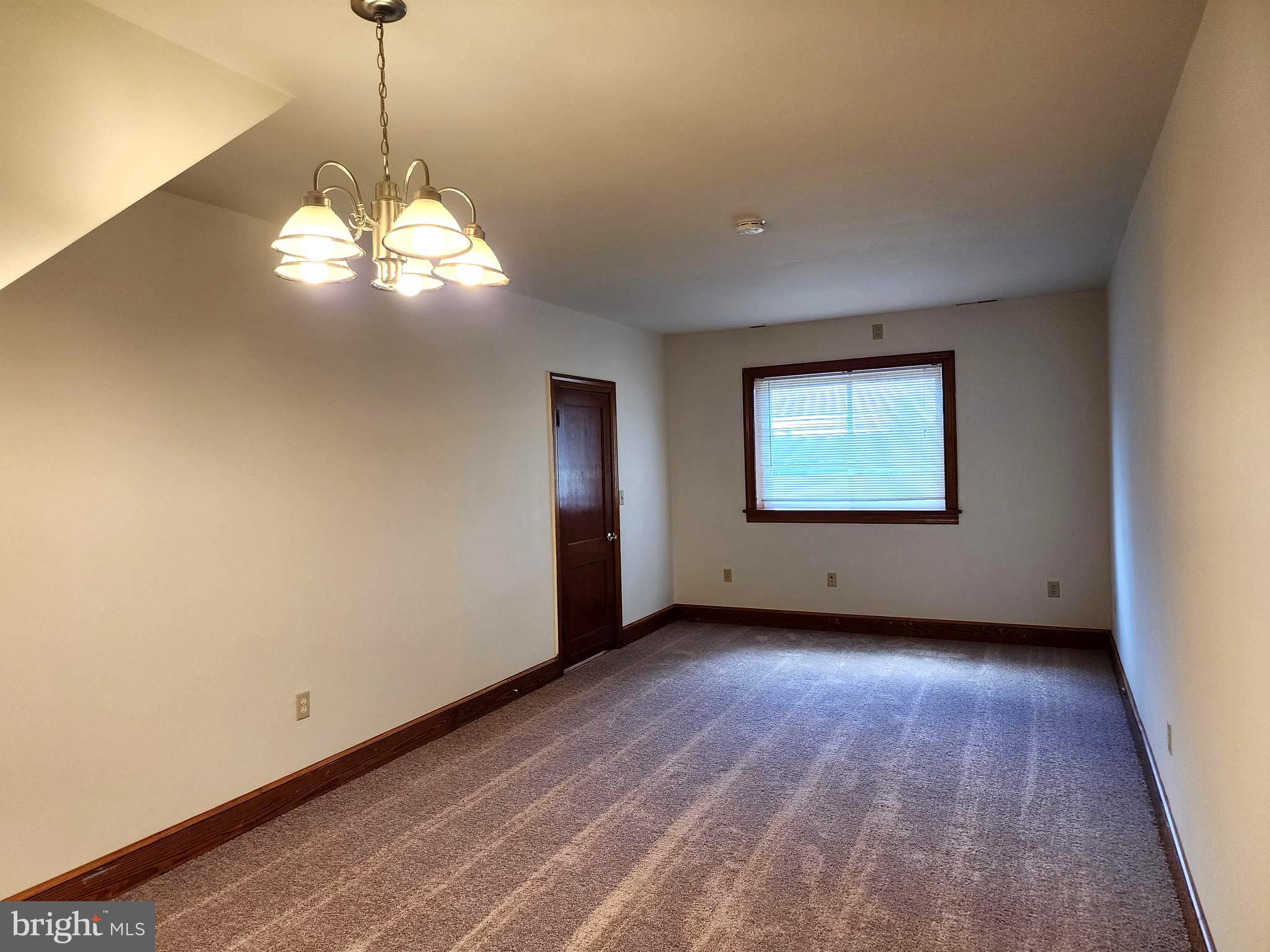 14352 Ridge Road King George, VA 22485 - Photo 18 of 30 a view of a big room with windows and chandelier