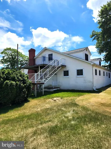 a backyard of a house with yard and garage