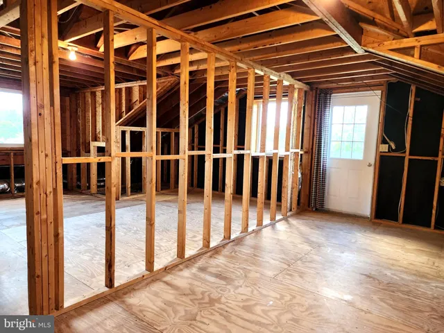 a view of a porch with wooden floor and fence