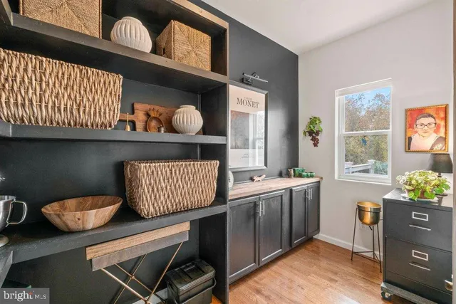 a kitchen with a sink a stove and cabinets