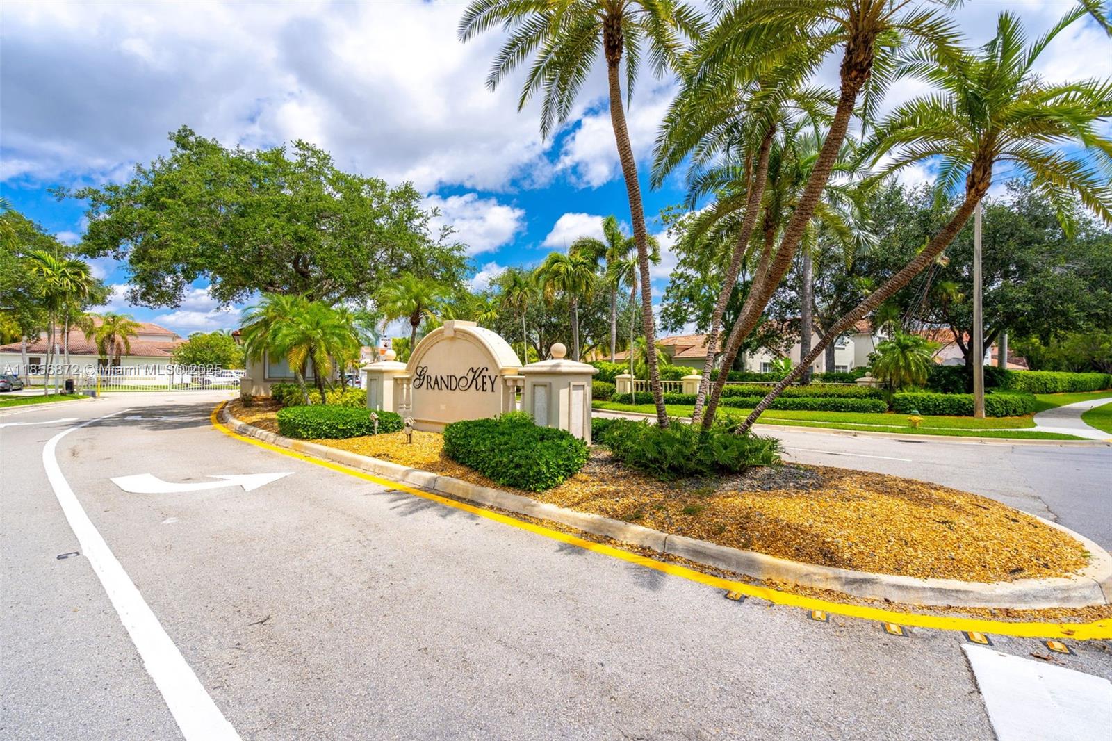 18801 Southwest 25th Court Miramar, FL 33029 - Photo 2 of 41 a view of a swimming pool with a garden and palm trees
