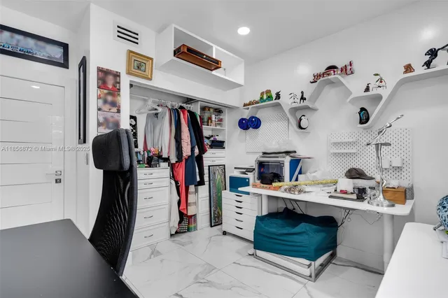 a bathroom with a sink toilet vanity and shower
