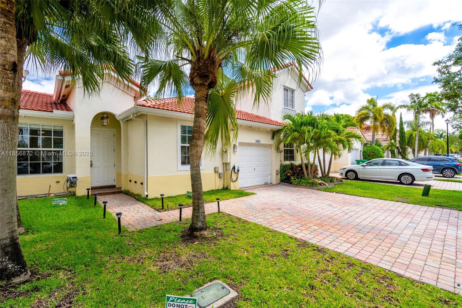 18801 Southwest 25th Court Miramar, FL 33029 - Photo 40 of 41 a view of a house with a yard and palm trees