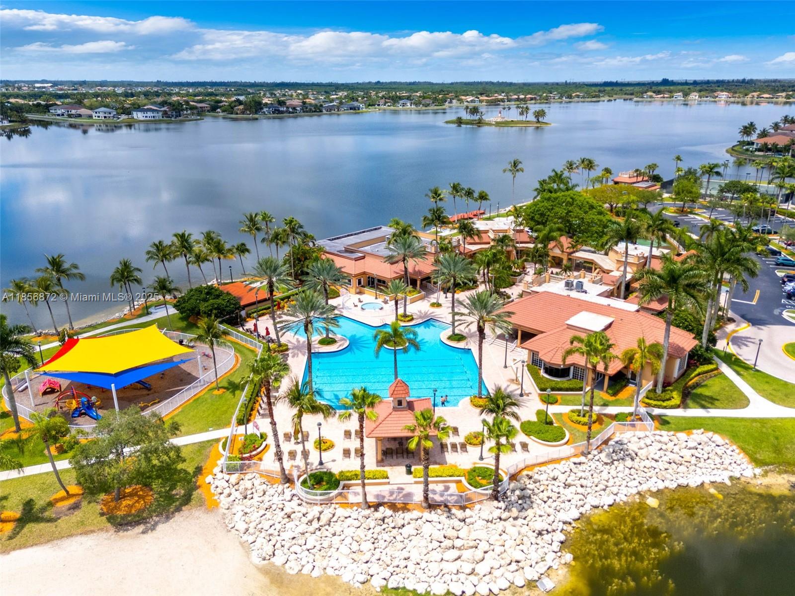 18801 Southwest 25th Court Miramar, FL 33029 - Photo 5 of 41 a view of a swimming pool with a table and chairs