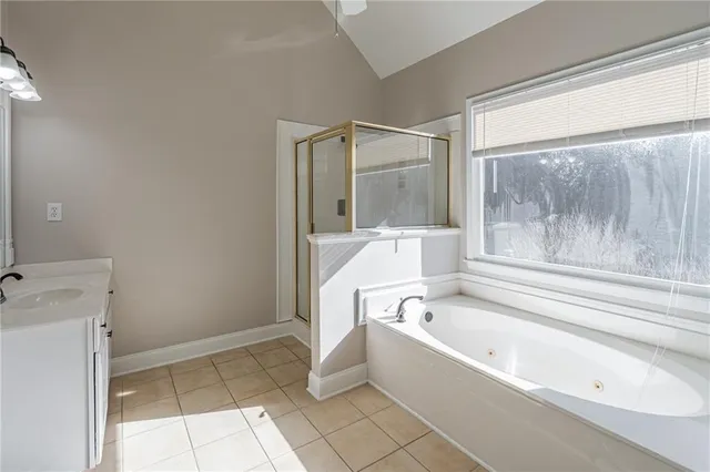 a bathroom with a bathtub and shower