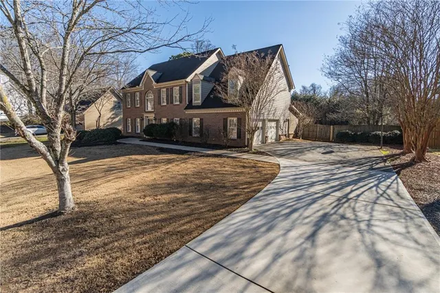 a view of a house with a snow in the yard