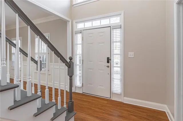 a view of entryway with wooden floor and door