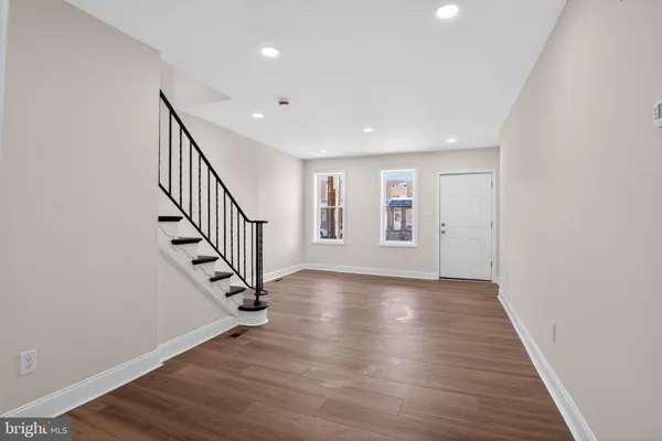 a kitchen with stainless steel appliances granite countertop a stove a refrigerator and a microwave